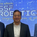 Three men smiling for photo